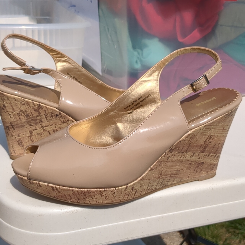 Beige patent leather peep toe platforms